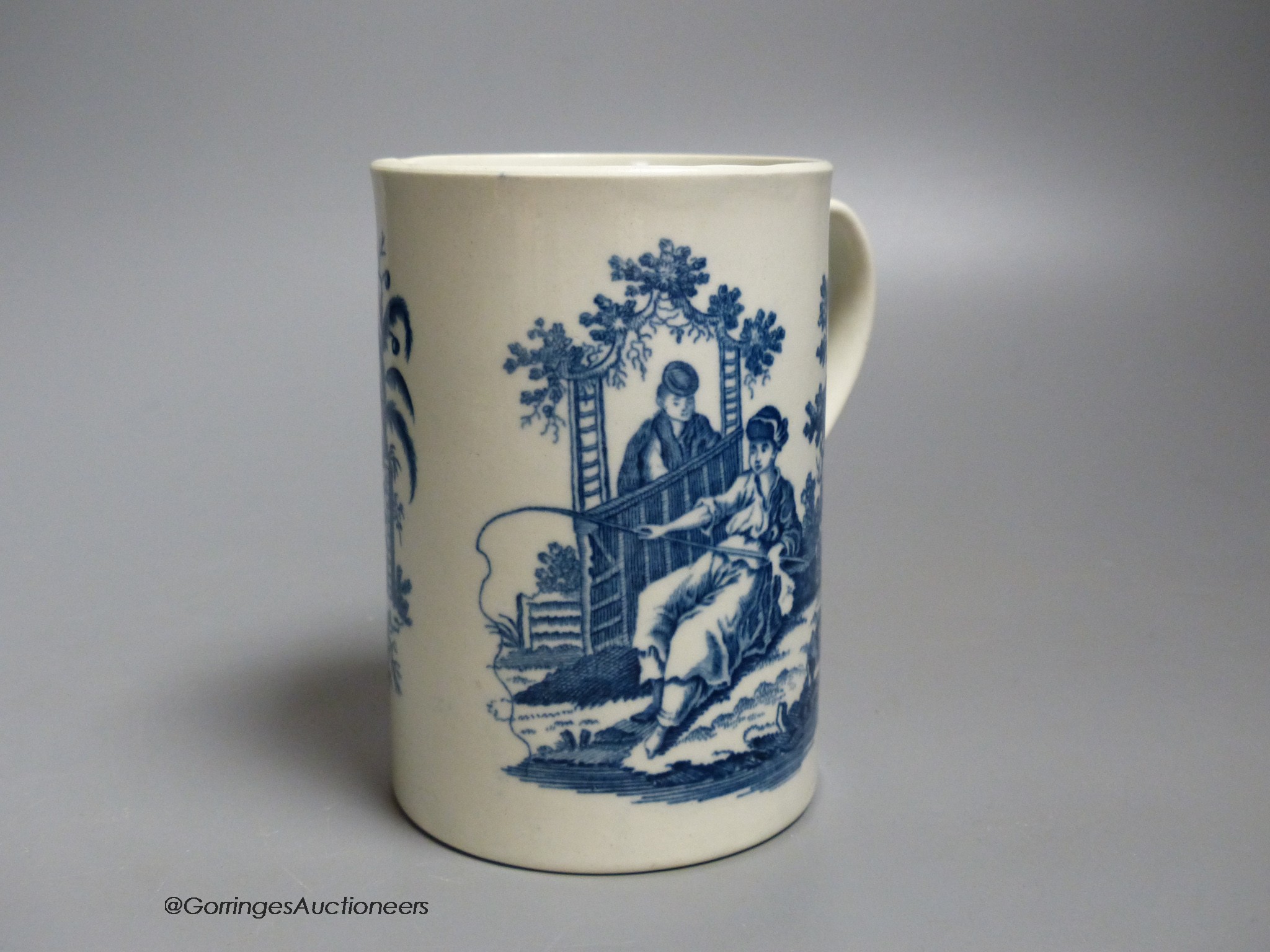 A Worcester 'La Peche and La Promenade Chinoise' pattern cylinder mug, printed in underglaze blue, shaded crescent mark, height 12cm